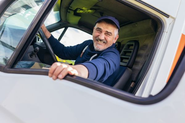 A truck driver smiling - stock image